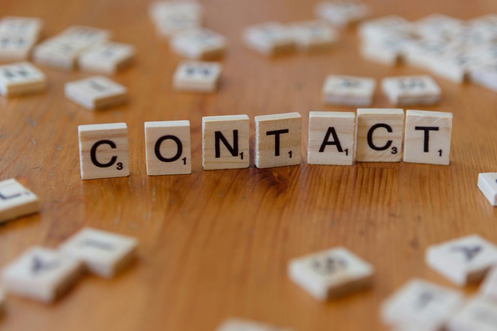 Contact page image showing wooden letter tiles spelling contact for line of credit for business, SBA loans, startup funding, business credit, and small business loans support.