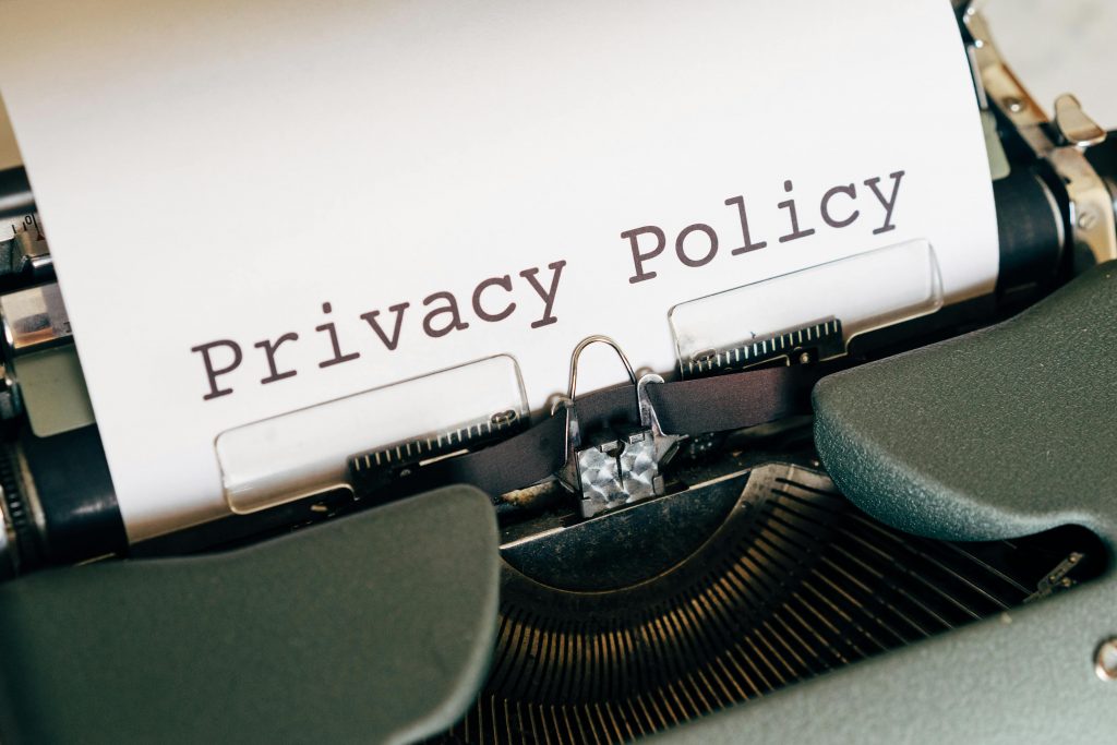 Privacy policy document typed on a typewriter representing secure business credit, startup funding, SBA loans, small business loans, and line of credit for business information protection.